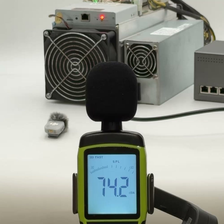 Sound level meter measuring the noise of a running Bitmain Antminer S9 in decibels